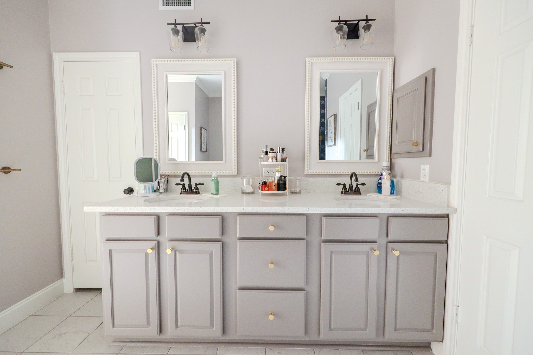 19 Feather Fall Place The Woodlands, TX 77381 - Photo 11 of 20 a bathroom with double sink and a mirror