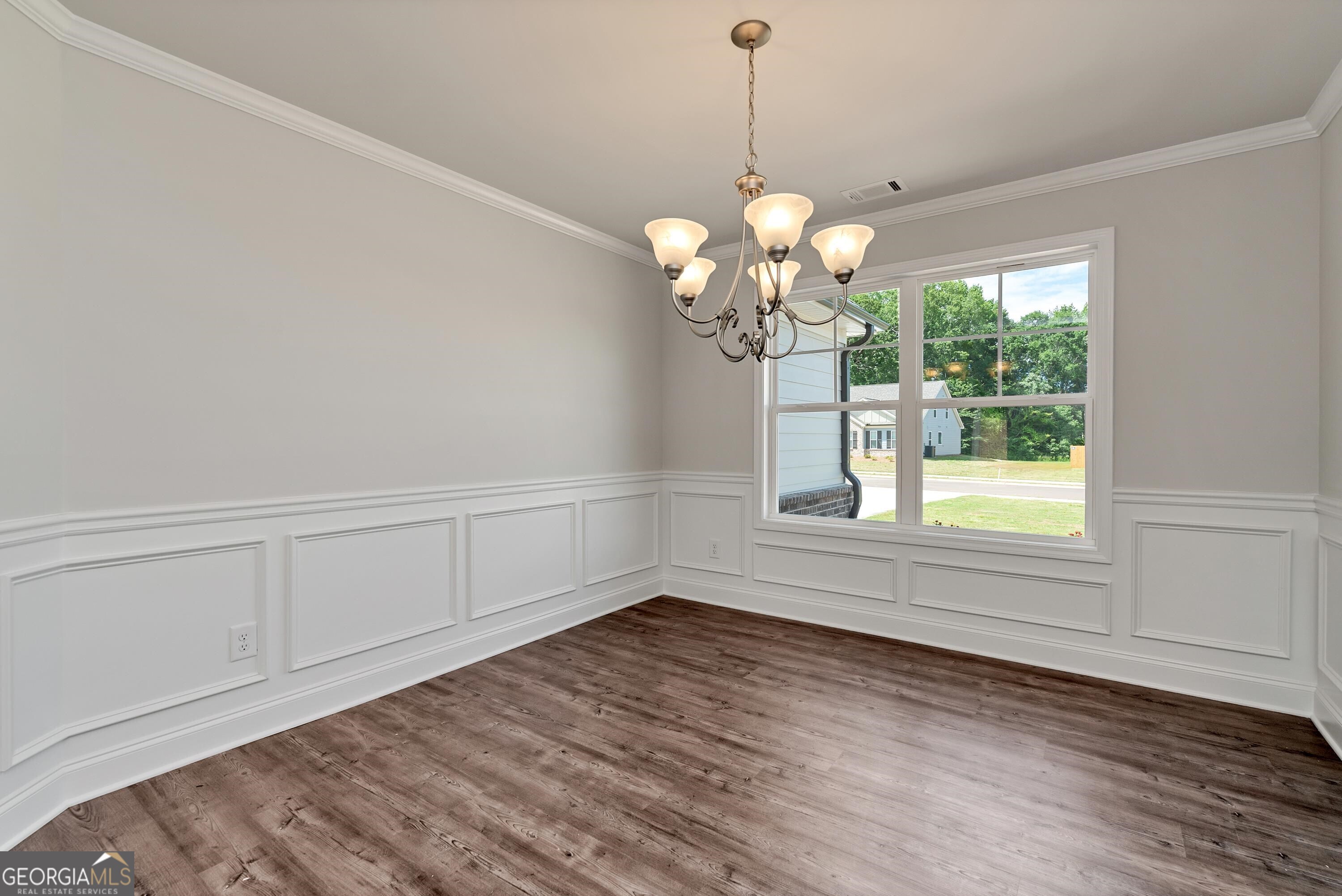 439 Equestrian Walk Winder, GA 30680 - Photo 12 of 33 a view of a room with wooden floor chandelier and windows