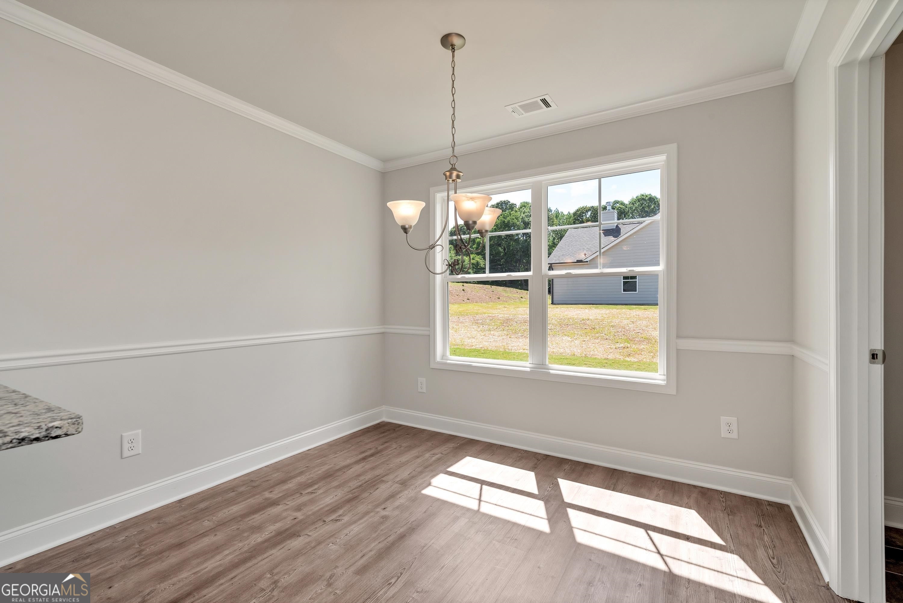 439 Equestrian Walk Winder, GA 30680 - Photo 13 of 33 a view of a room with window and wooden floor