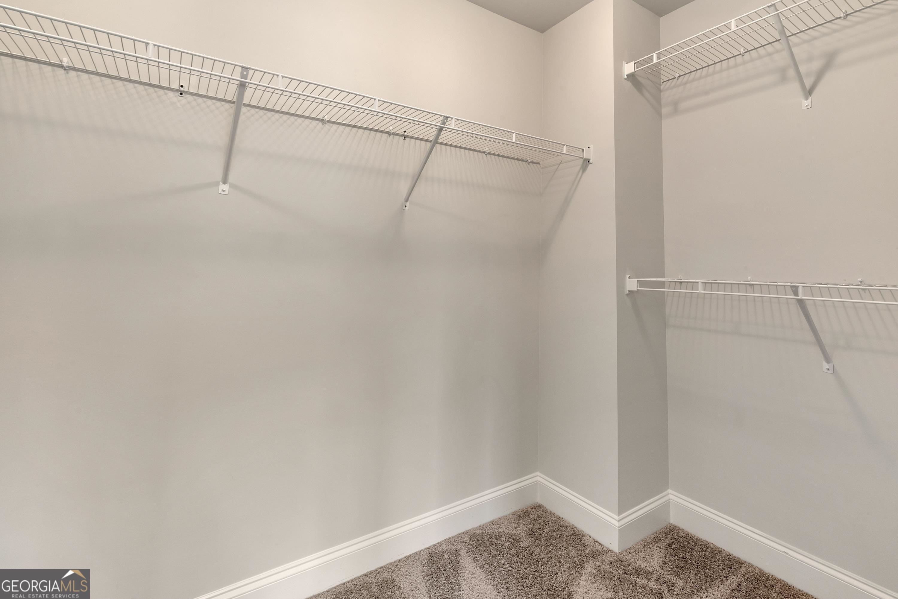 439 Equestrian Walk Winder, GA 30680 - Photo 20 of 33 a view of a room with racks on the wall