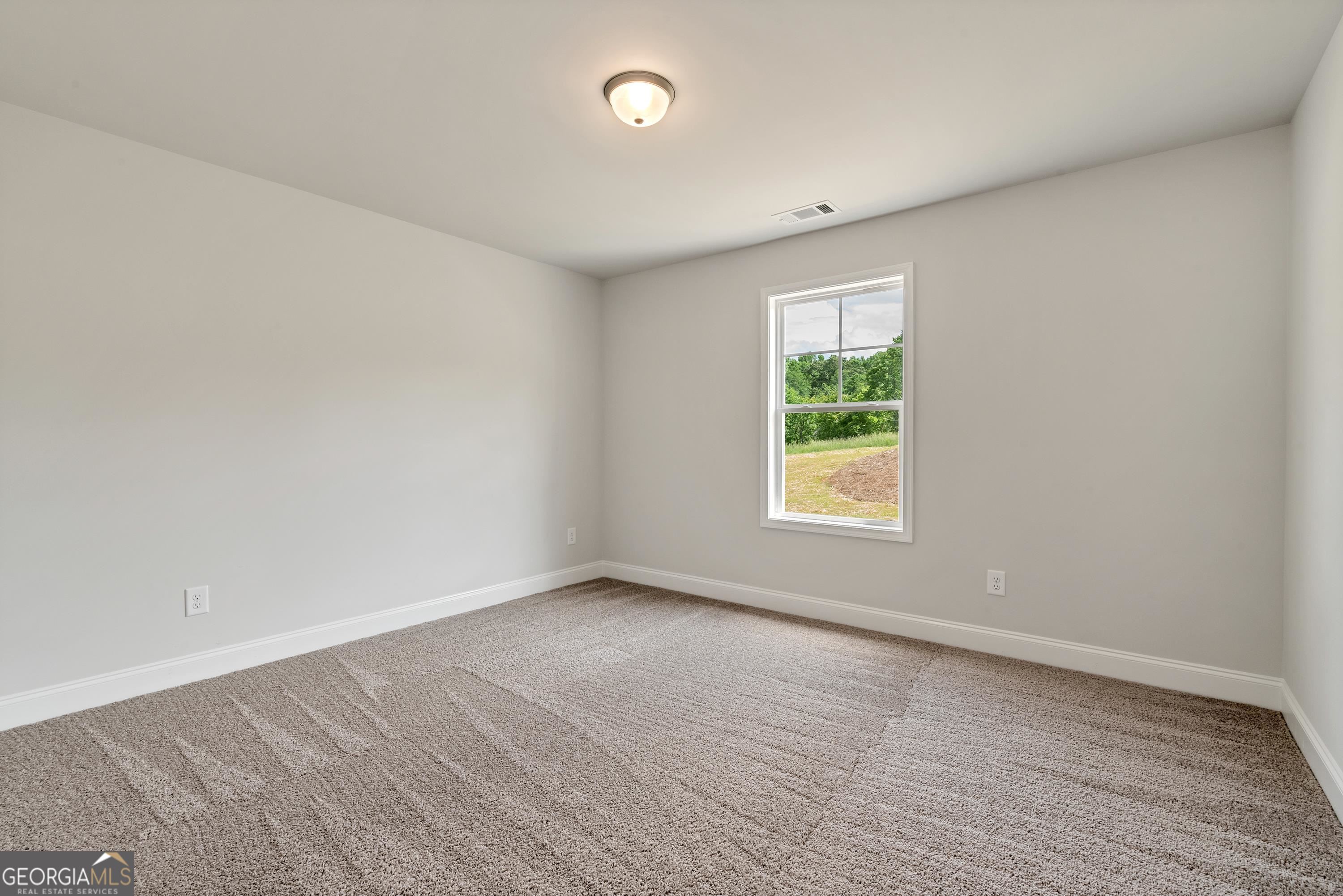 439 Equestrian Walk Winder, GA 30680 - Photo 21 of 33 a view of an empty room with a window