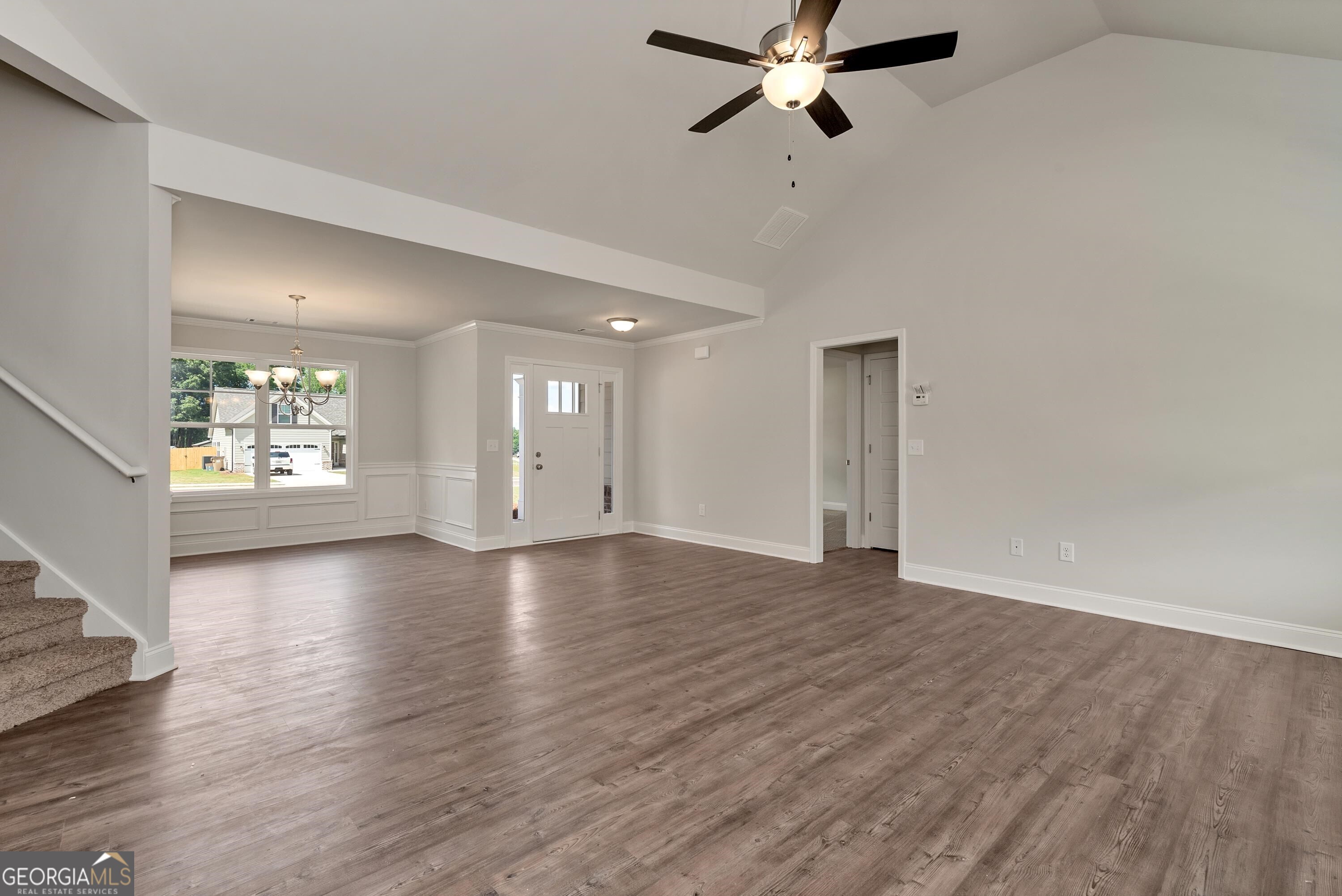 439 Equestrian Walk Winder, GA 30680 - Photo 8 of 33 a view of an empty room with wooden floor and a window
