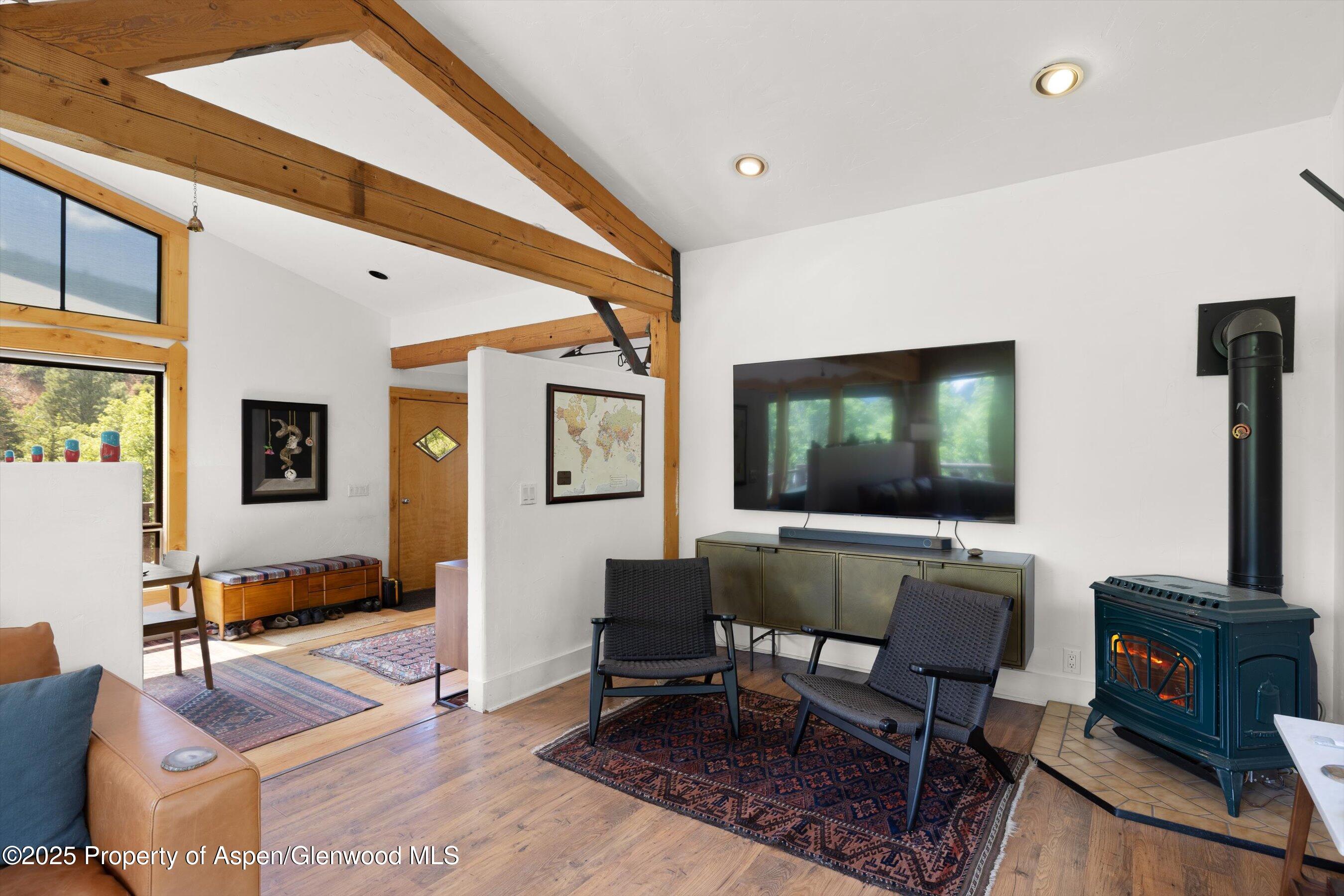 116 South Bill Creek Road Carbondale, CO 81623 - Photo 11 of 45 a living room with furniture and a flat screen tv