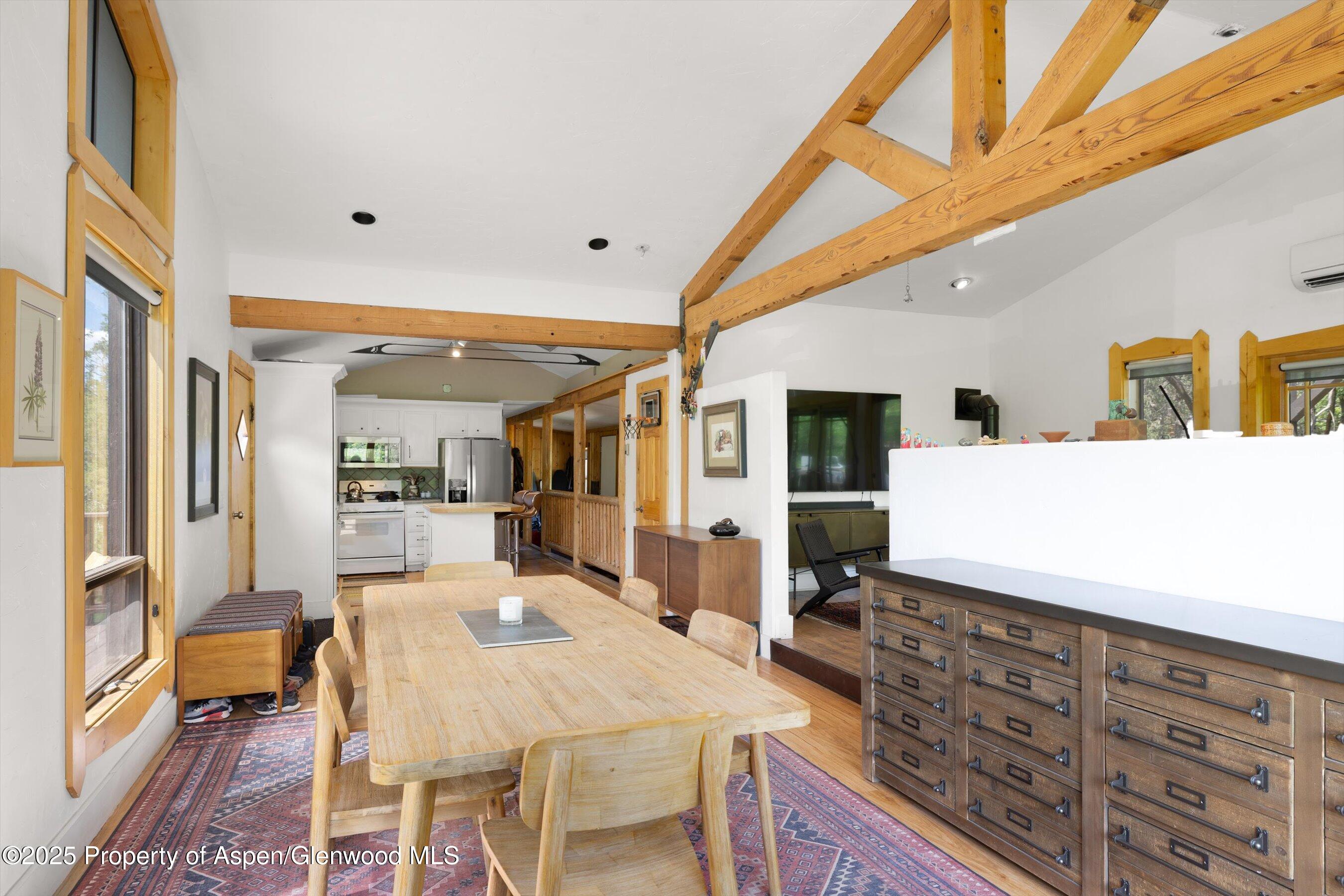 116 South Bill Creek Road Carbondale, CO 81623 - Photo 14 of 45 a dining hall with stainless steel appliances kitchen island granite countertop a table and chairs