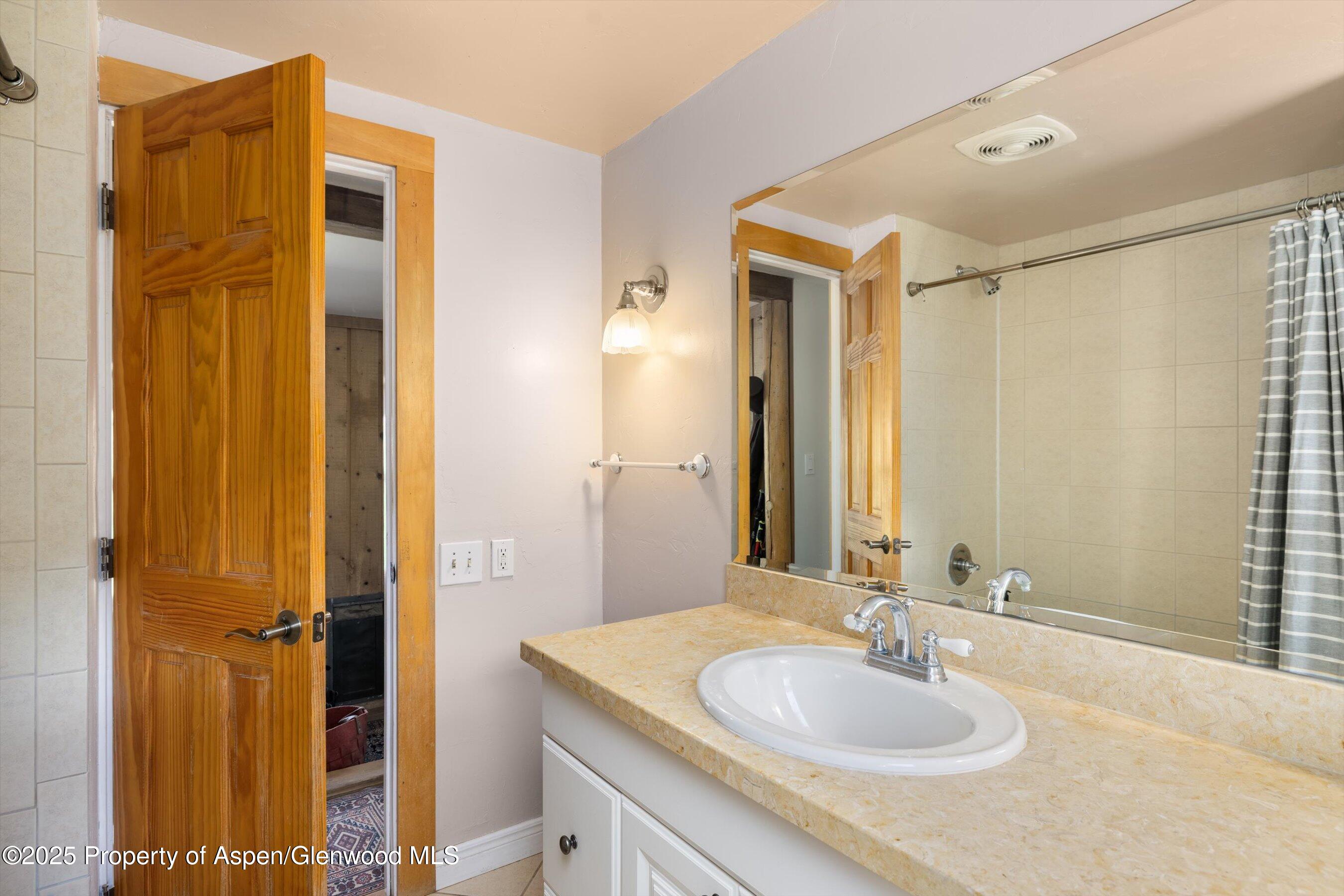 116 South Bill Creek Road Carbondale, CO 81623 - Photo 19 of 45 a bathroom with a sink and a mirror