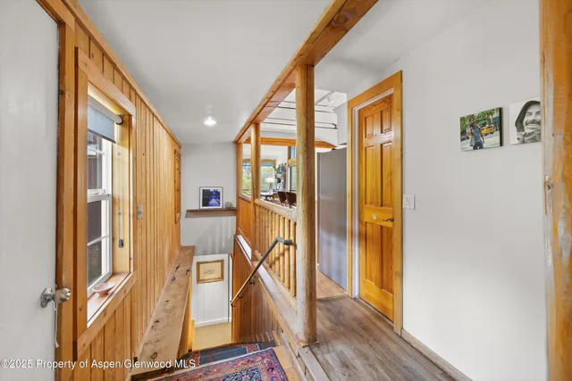 a view of an entryway with wooden floor