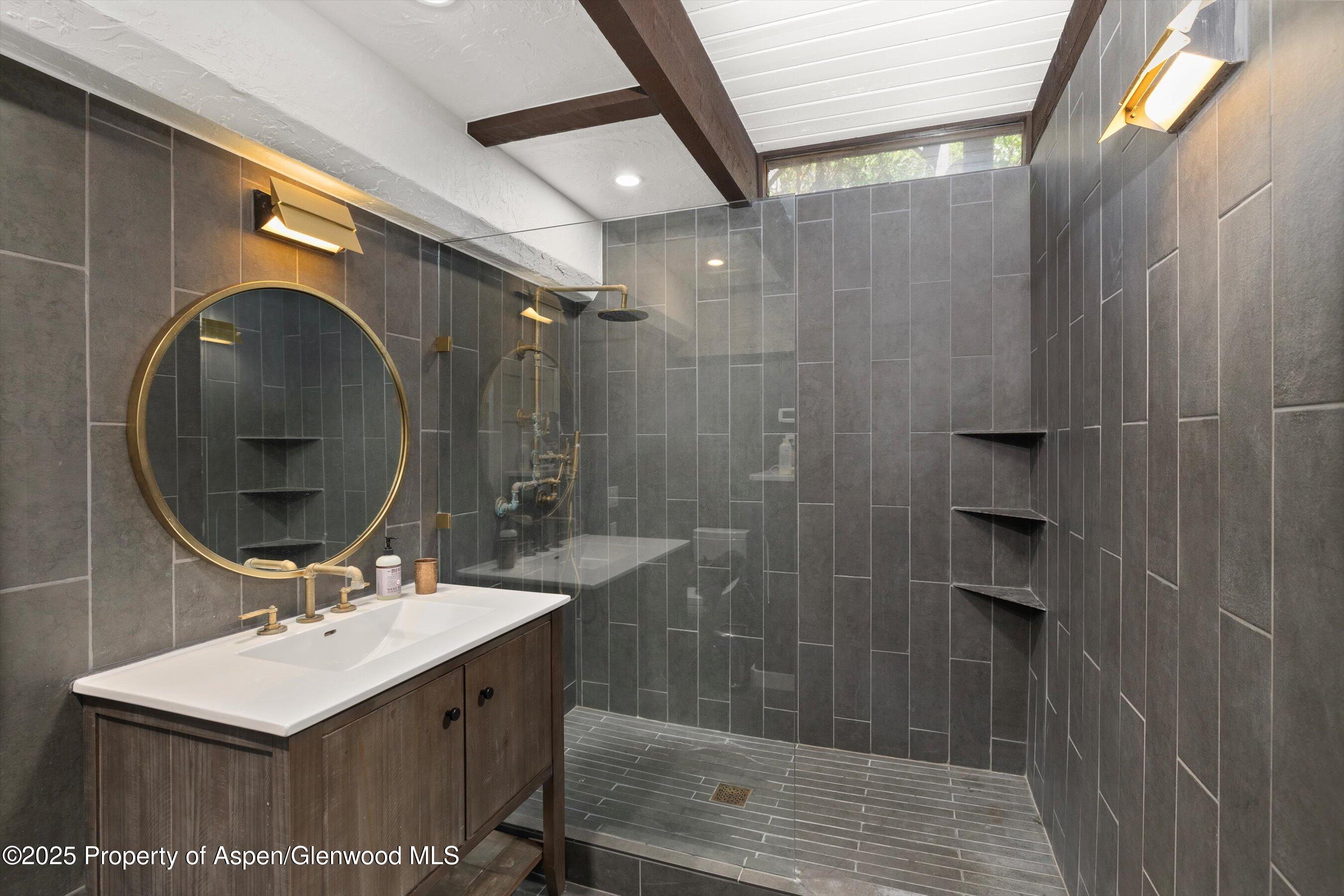 116 South Bill Creek Road Carbondale, CO 81623 - Photo 25 of 45 a bathroom with a sink mirror and shower