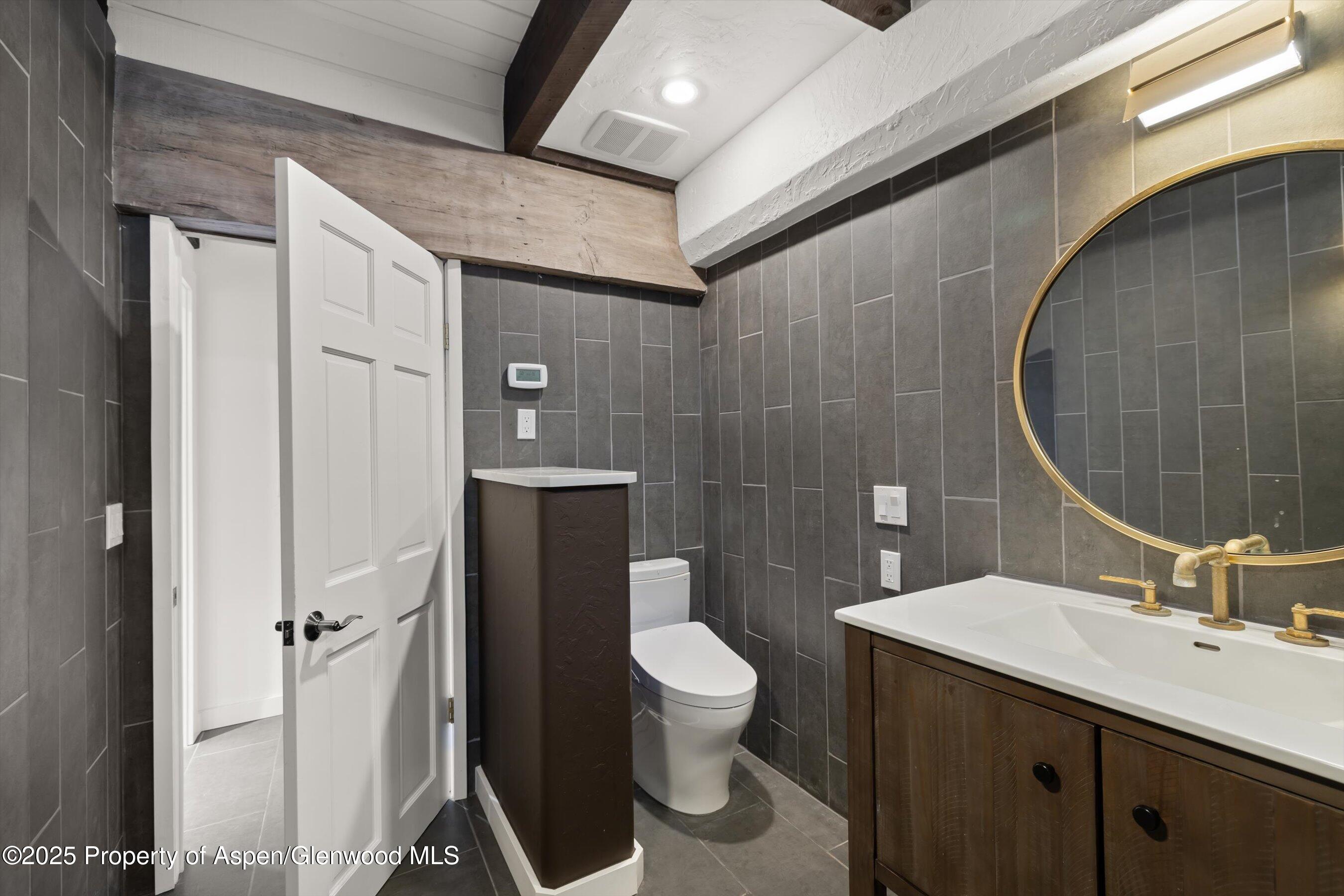 116 South Bill Creek Road Carbondale, CO 81623 - Photo 26 of 45 a bathroom with a sink toilet and shower