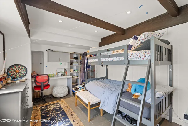 a living room with furniture a rug and a table