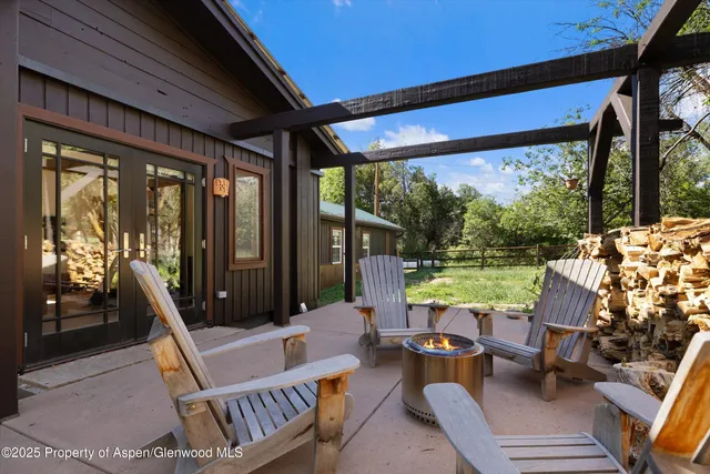 a view of porch with furniture and garden