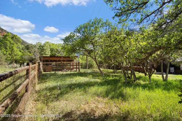a view of swimming pool with a yard