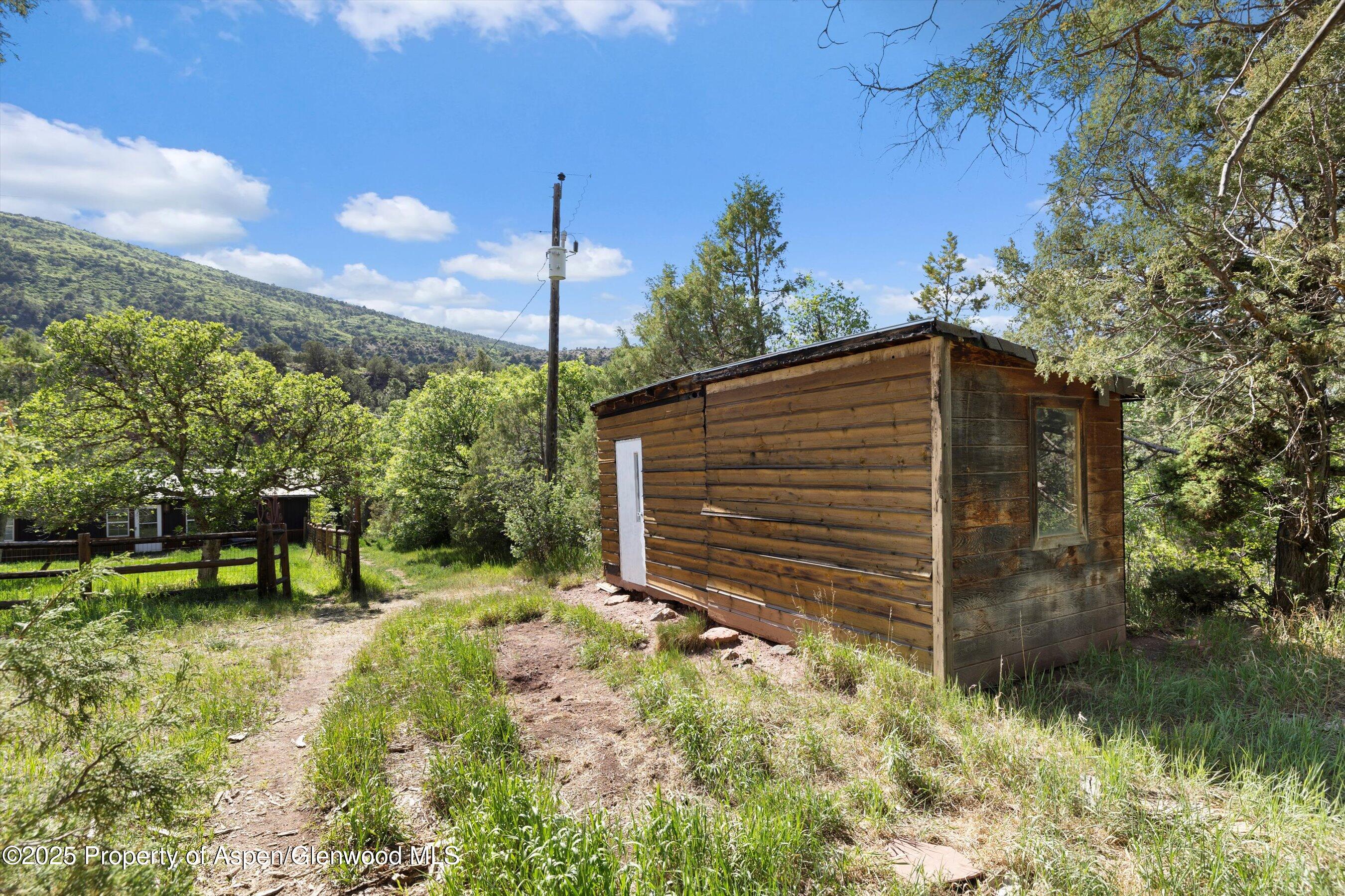 116 South Bill Creek Road Carbondale, CO 81623 - Photo 38 of 45 a backyard of a house with lots of green space