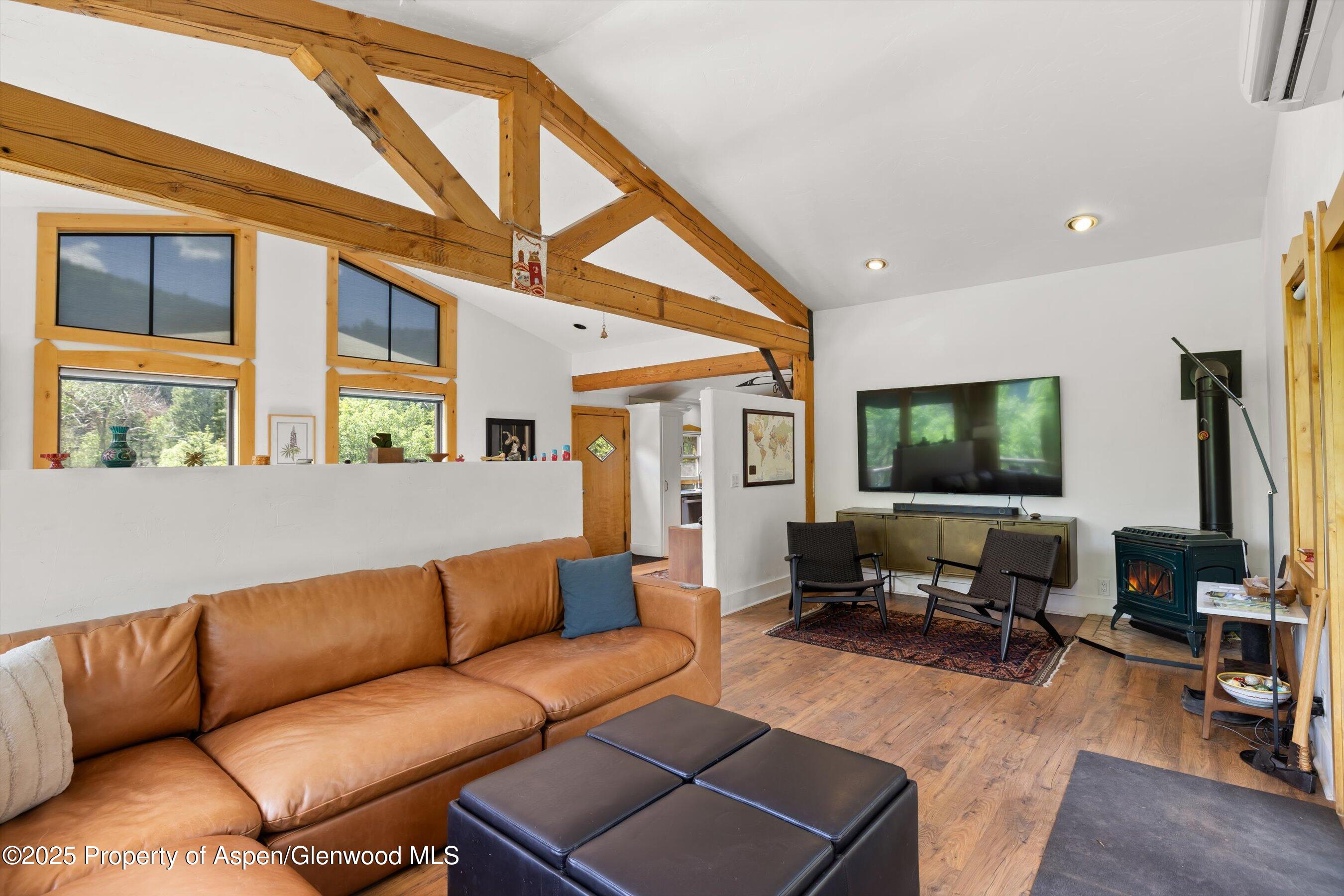 116 South Bill Creek Road Carbondale, CO 81623 - Photo 10 of 45 a living room with furniture a flat screen tv and large window