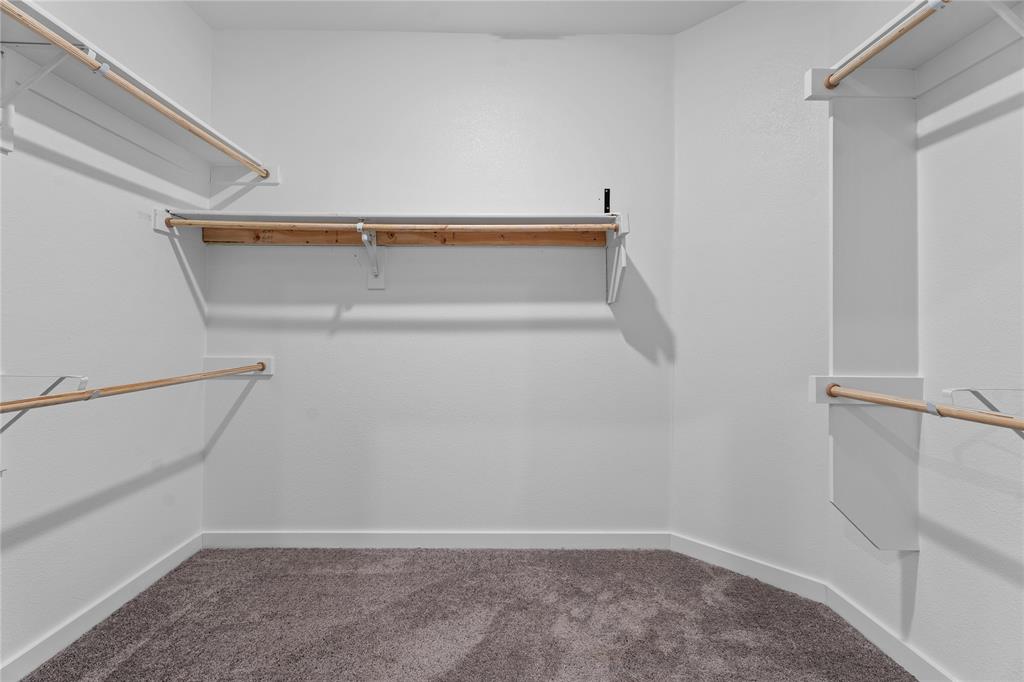 718 Parkside Drive Lavon, TX 75166 - Photo 7 of 22 Walk in closet with dark carpet