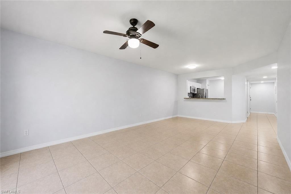 5737 Whitaker Road, Unit C101 Naples, FL 34112 - Photo 14 of 28 a view of empty room with a ceiling fan
