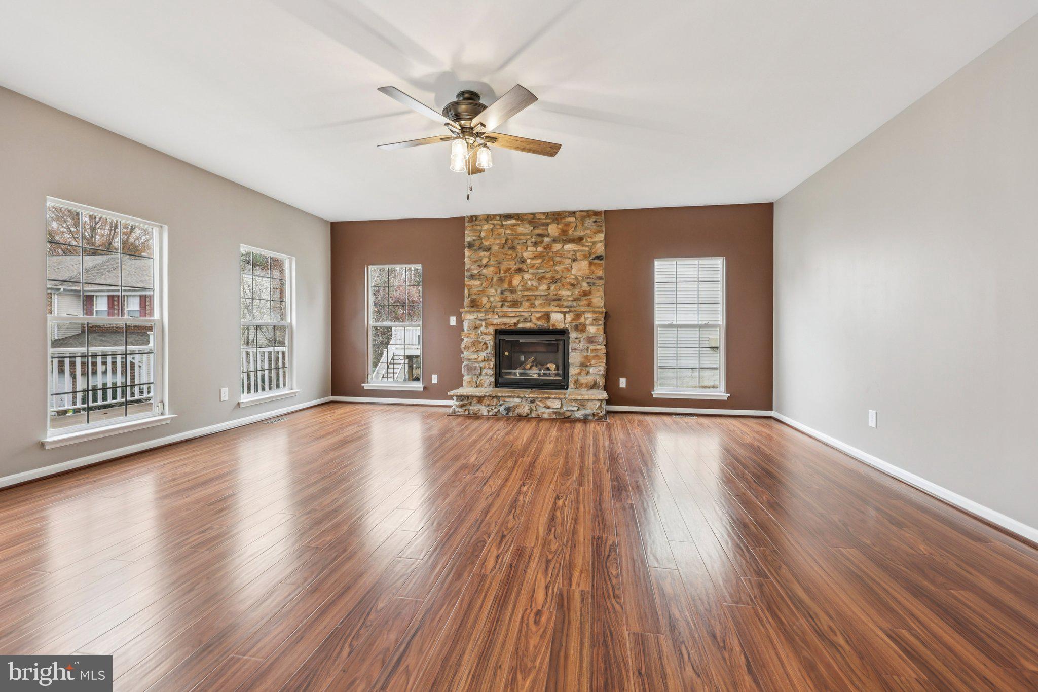 15730 Marbury Heights Way Montclair, VA 22025 - Photo 11 of 69 a view of an empty room with wooden floor and a window