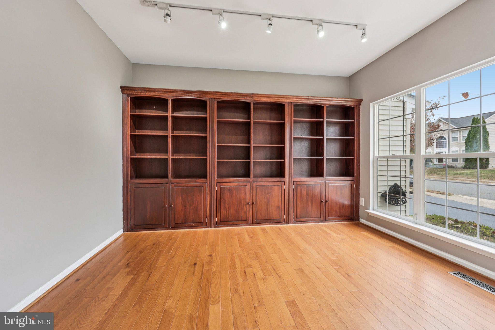 15730 Marbury Heights Way Montclair, VA 22025 - Photo 21 of 69 a view of an empty room with a wooden floor and a window