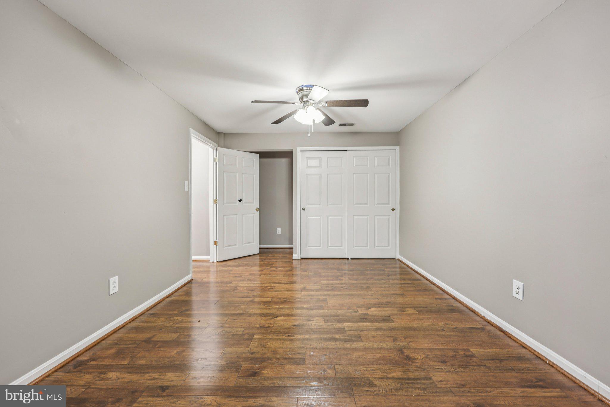 15730 Marbury Heights Way Montclair, VA 22025 - Photo 26 of 69 a view of an empty room with chandelier fan and windows