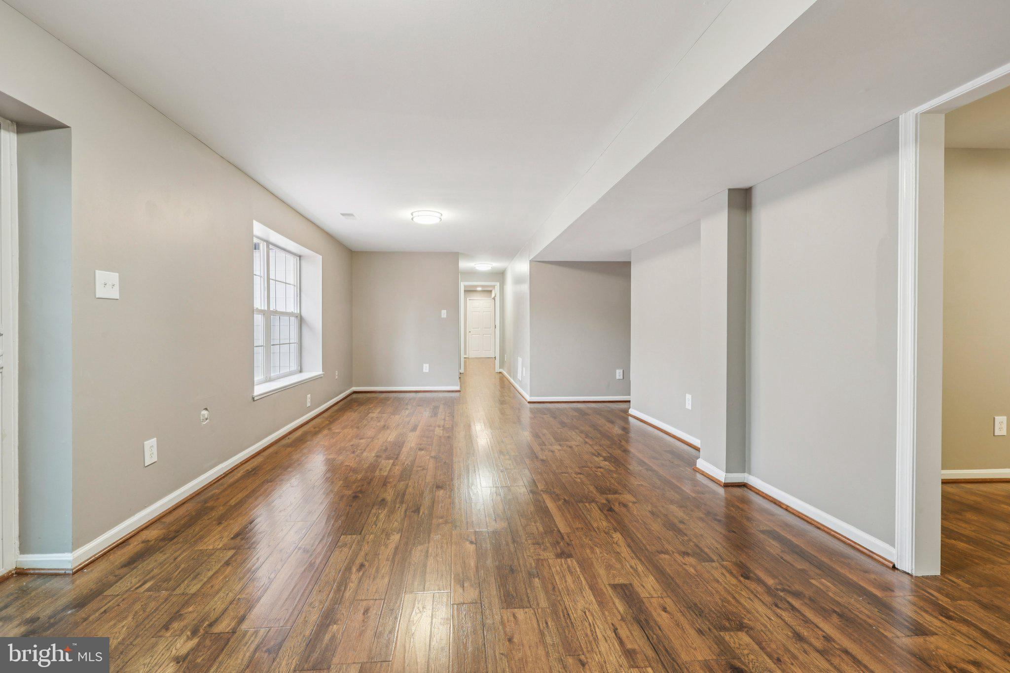 15730 Marbury Heights Way Montclair, VA 22025 - Photo 28 of 69 a view of an empty room with wooden floor and a window