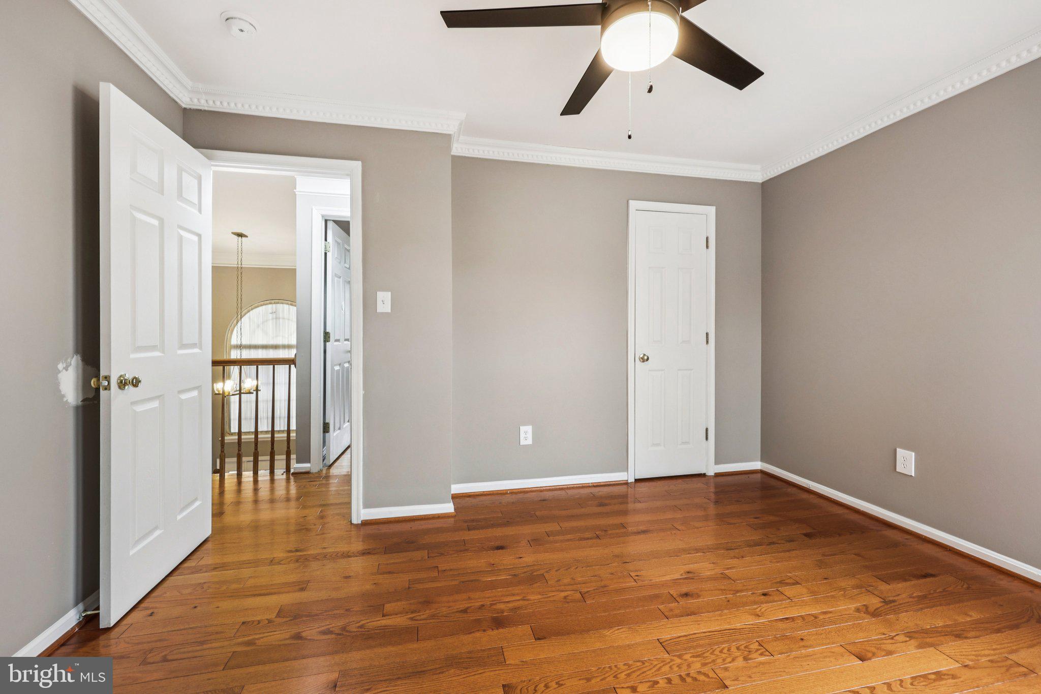 15730 Marbury Heights Way Montclair, VA 22025 - Photo 36 of 69 a view of a big room with wooden floor and windows