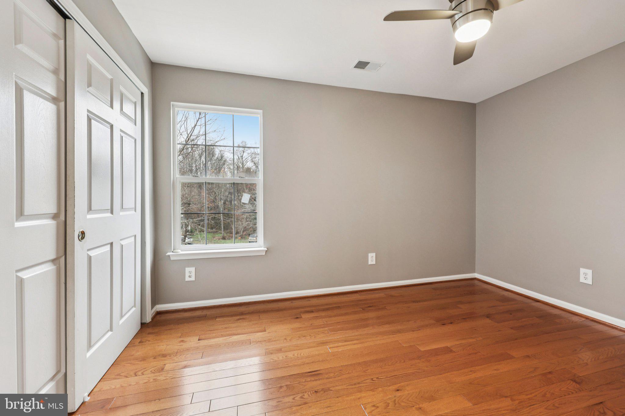 15730 Marbury Heights Way Montclair, VA 22025 - Photo 39 of 69 wooden floor in an empty room with a window