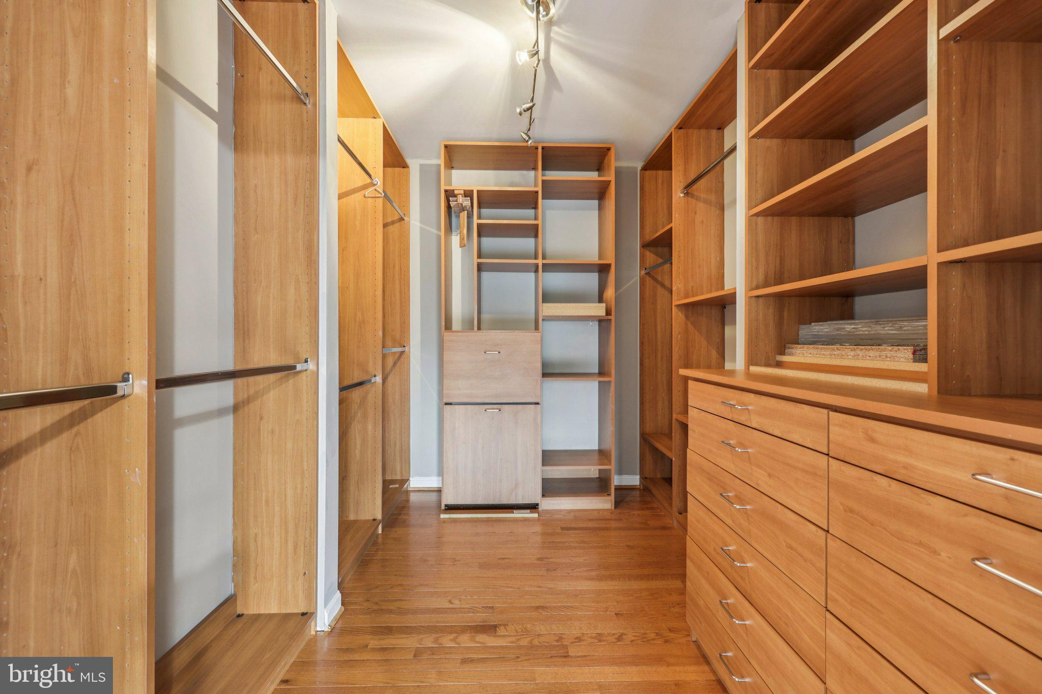 15730 Marbury Heights Way Montclair, VA 22025 - Photo 47 of 69 a view of walk in closet with empty racks