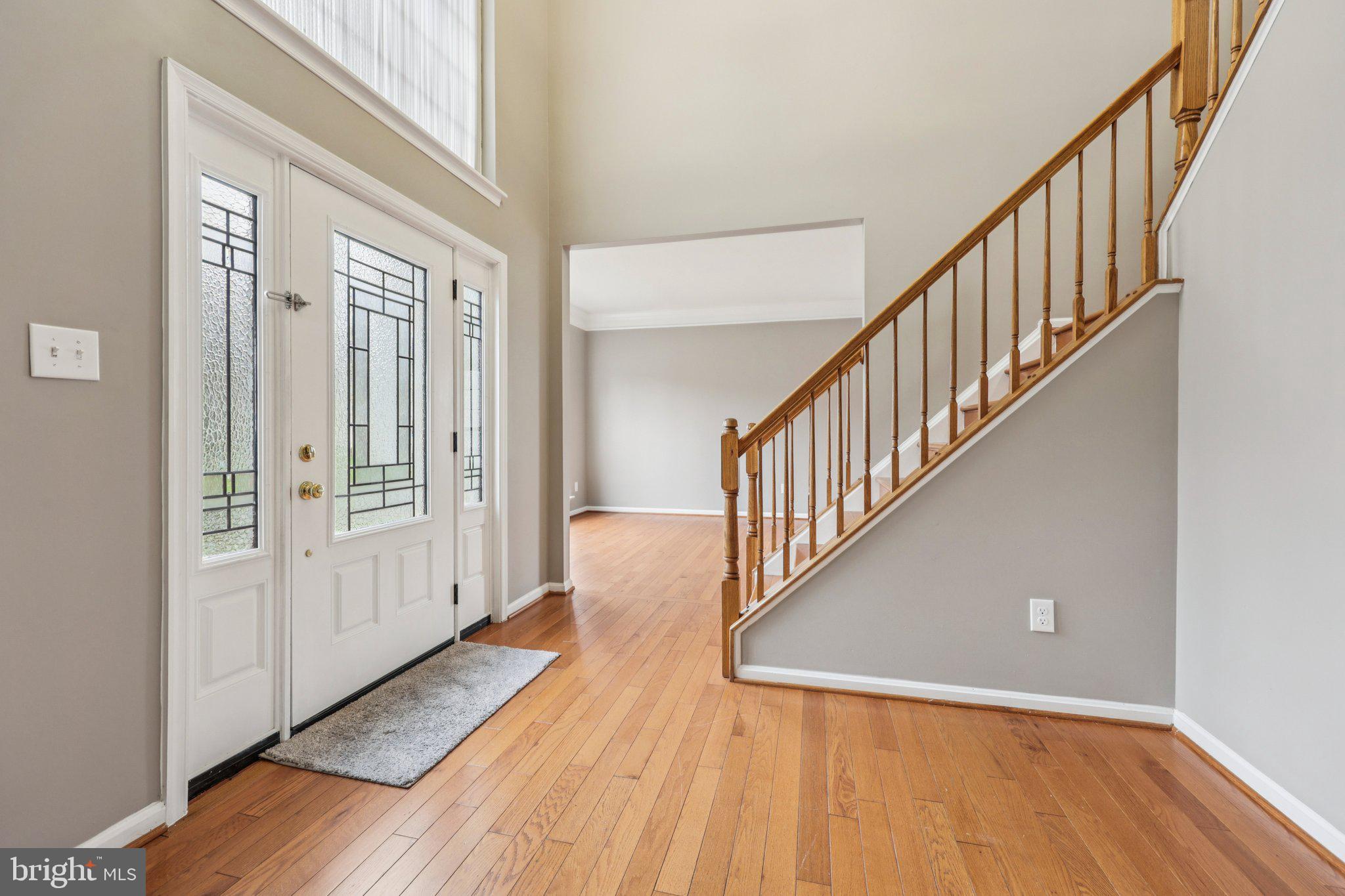 15730 Marbury Heights Way Montclair, VA 22025 - Photo 5 of 69 a view of a hallway with wooden floor and staircase