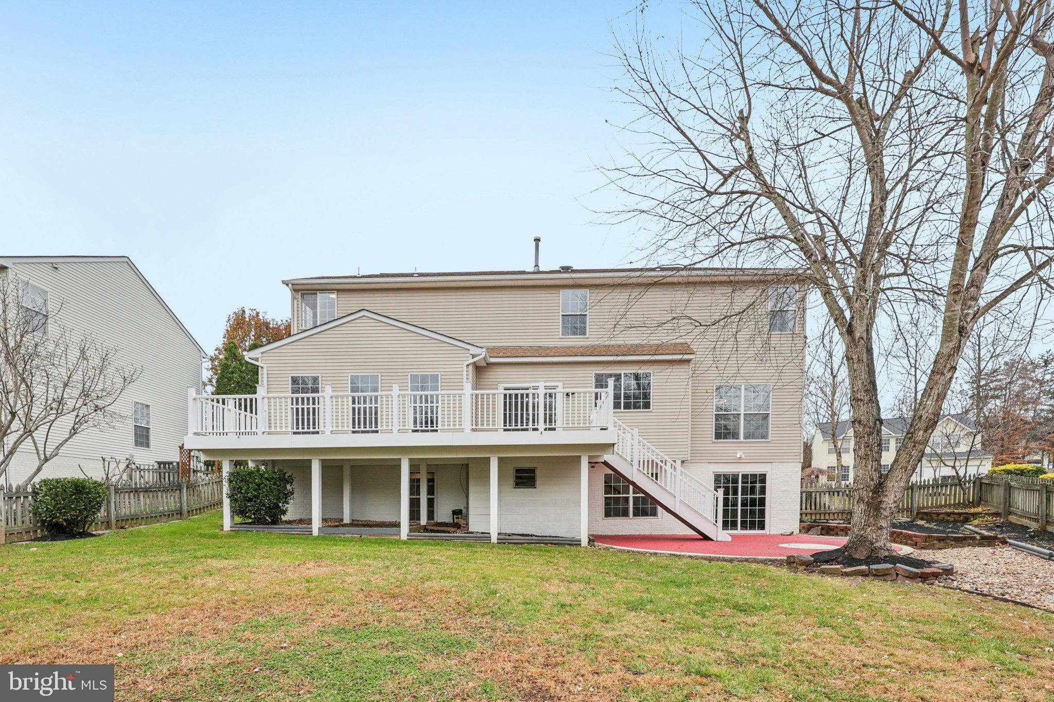 15730 Marbury Heights Way Montclair, VA 22025 - Photo 53 of 69 a view of a house with a big yard and large trees