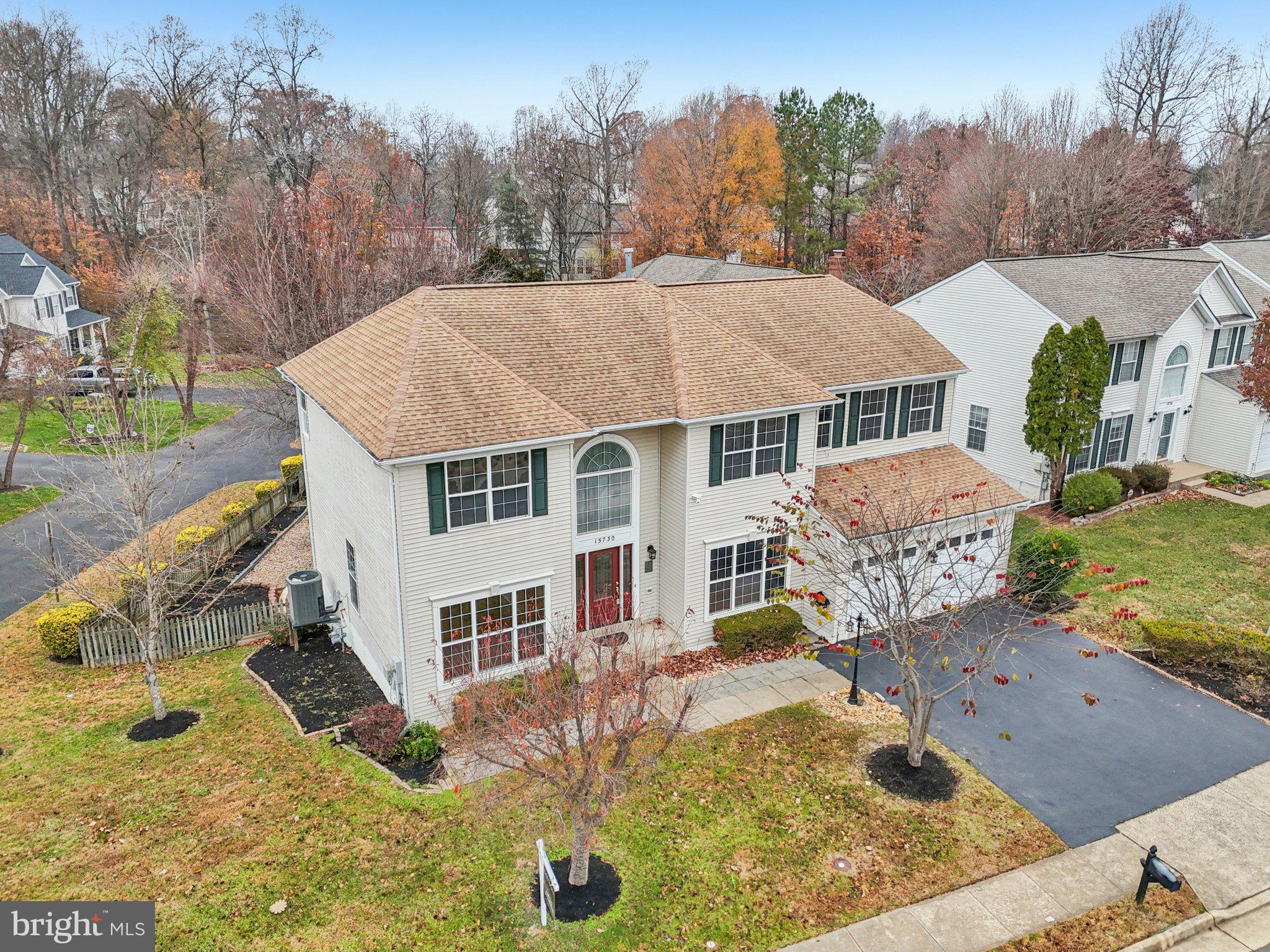 15730 Marbury Heights Way Montclair, VA 22025 - Photo 56 of 69 a aerial view of a house with yard and trees in the background