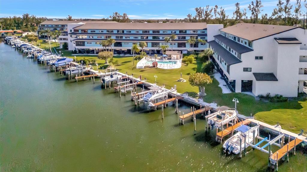 9604 Cortez Road West, Unit 222 Bradenton, FL 34210 - Photo 11 of 54 an aerial view of a house with swimming pool and outdoor seating
