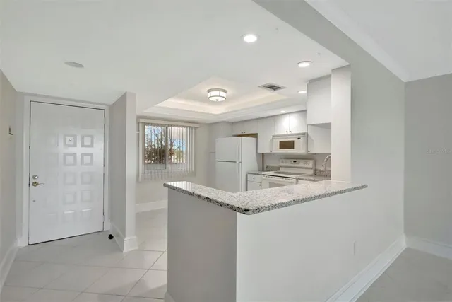 a view of an empty room with glass door