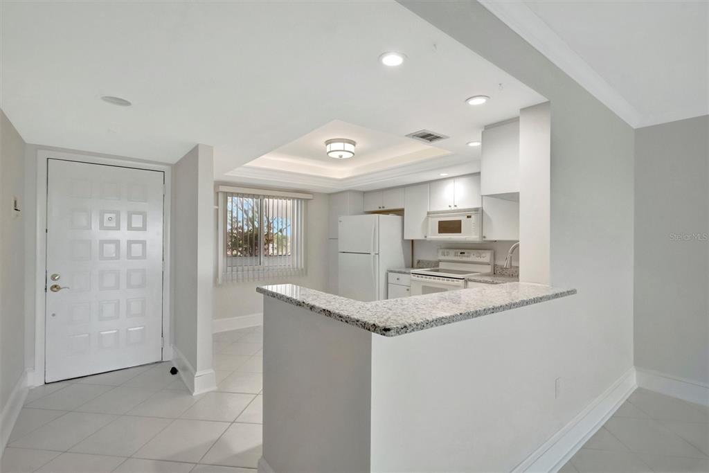 9604 Cortez Road West, Unit 222 Bradenton, FL 34210 - Photo 18 of 54 a kitchen with stainless steel appliances granite countertop a sink and cabinets