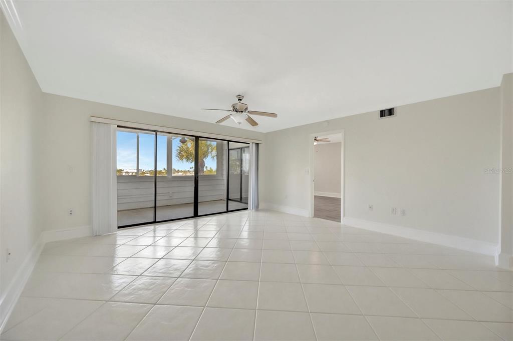 9604 Cortez Road West, Unit 222 Bradenton, FL 34210 - Photo 23 of 54 a view of an empty room with glass door