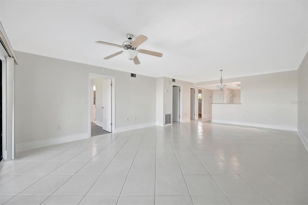 9604 Cortez Road West, Unit 222 Bradenton, FL 34210 - Photo 24 of 54 a view of empty room with wooden floor and ceiling fan