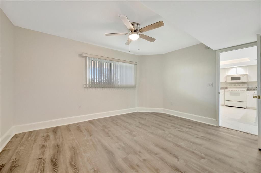 9604 Cortez Road West, Unit 222 Bradenton, FL 34210 - Photo 32 of 54 wooden floor in an empty room with a window