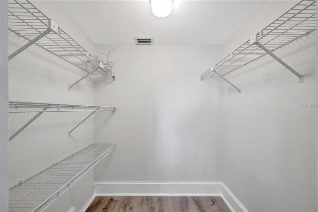 9604 Cortez Road West, Unit 222 Bradenton, FL 34210 - Photo 33 of 54 a view of walk in closet with empty racks