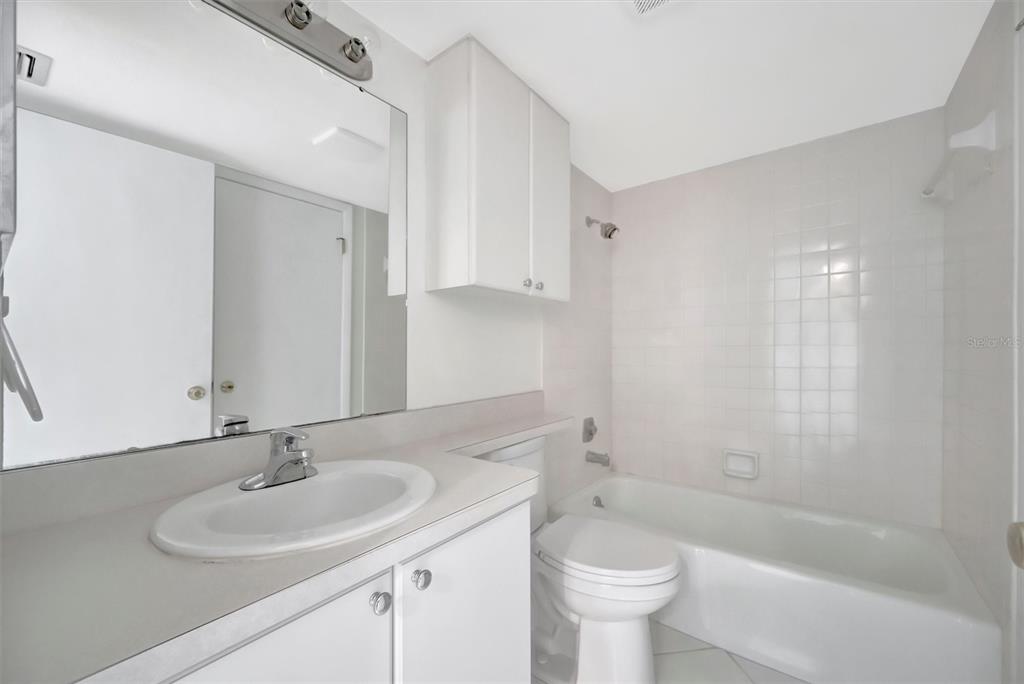 9604 Cortez Road West, Unit 222 Bradenton, FL 34210 - Photo 34 of 54 a bathroom with a sink a toilet and shower