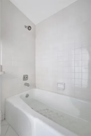 a spacious bathroom with a double vanity sink and a mirror