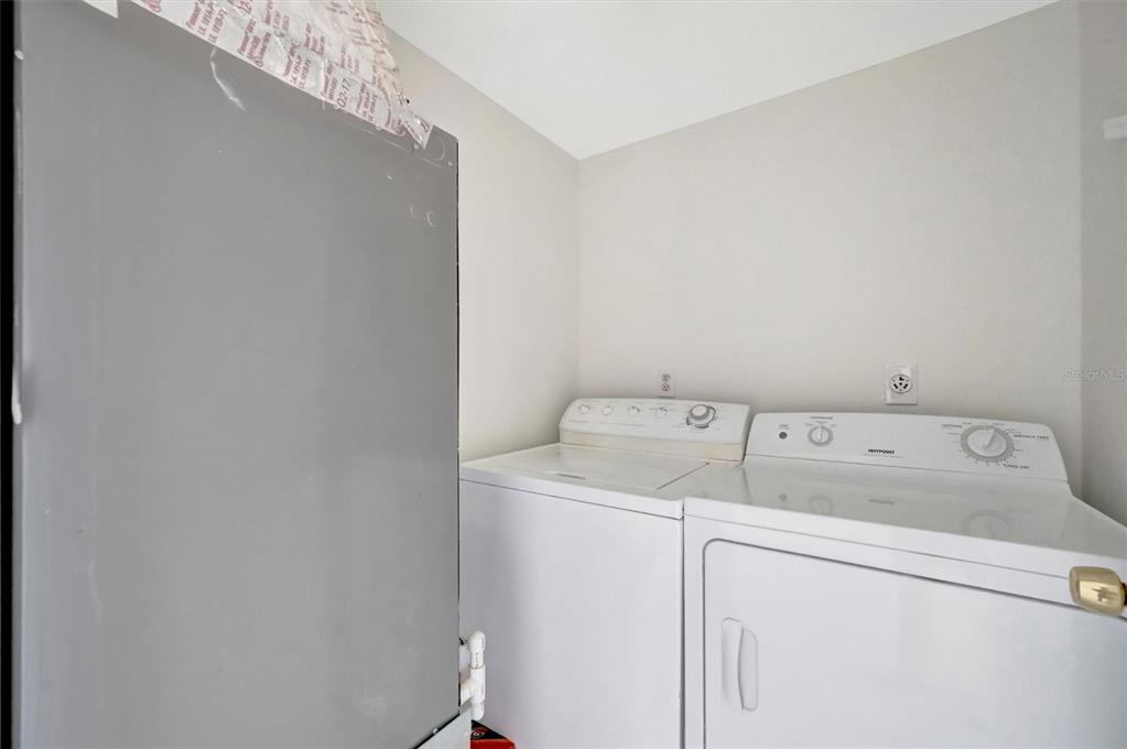 9604 Cortez Road West, Unit 222 Bradenton, FL 34210 - Photo 37 of 54 a utility room with dryer and washer