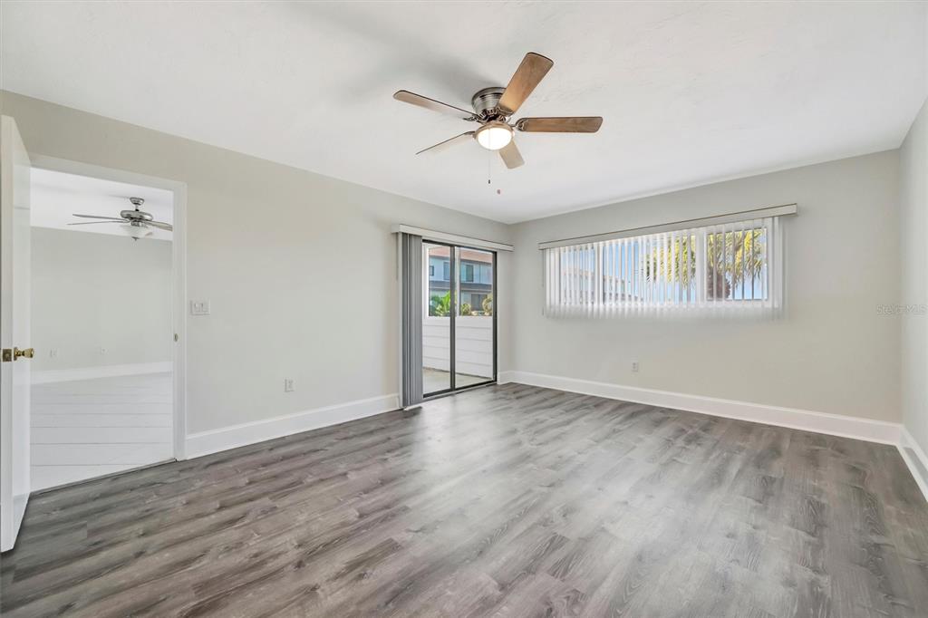 9604 Cortez Road West, Unit 222 Bradenton, FL 34210 - Photo 39 of 54 a view of an empty room with wooden floor and a window