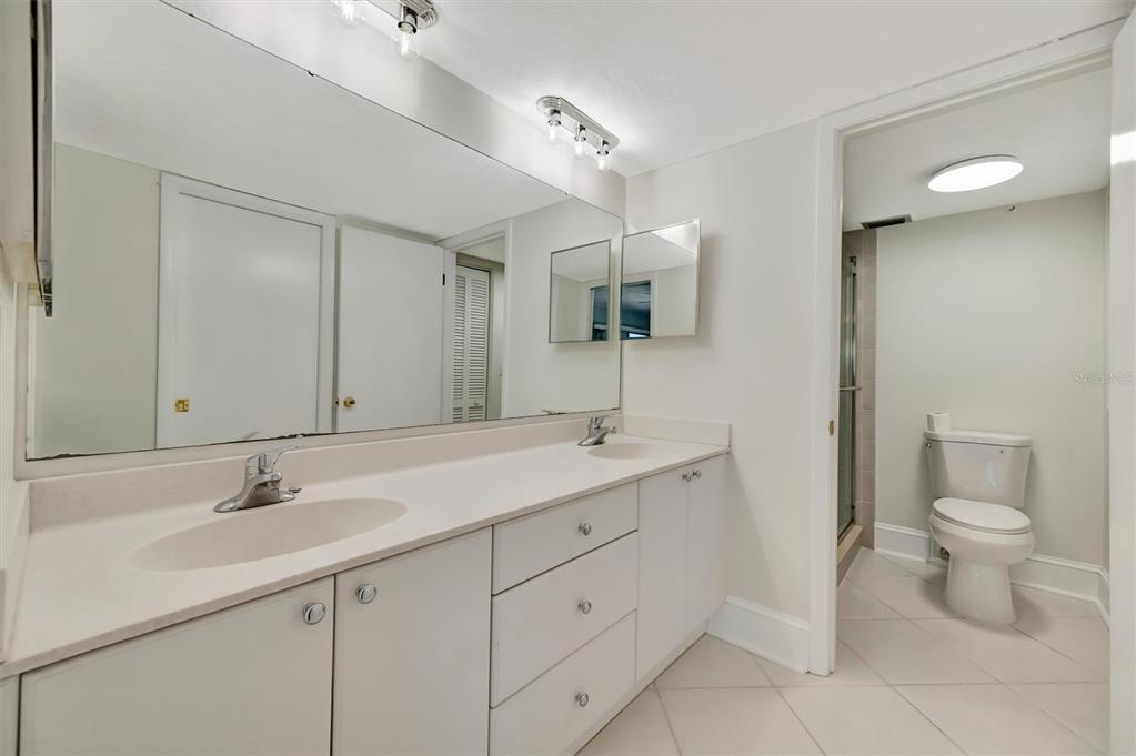 9604 Cortez Road West, Unit 222 Bradenton, FL 34210 - Photo 42 of 54 a spacious bathroom with a double vanity sink and a mirror