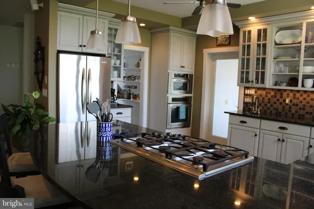 a living room with furniture fireplace and a flat screen tv
