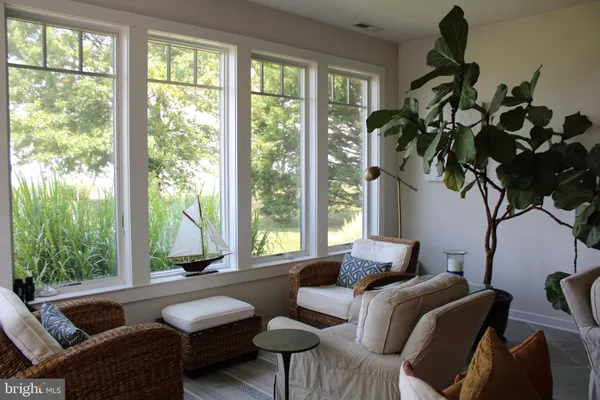 a livingroom with furniture hardwood and a window