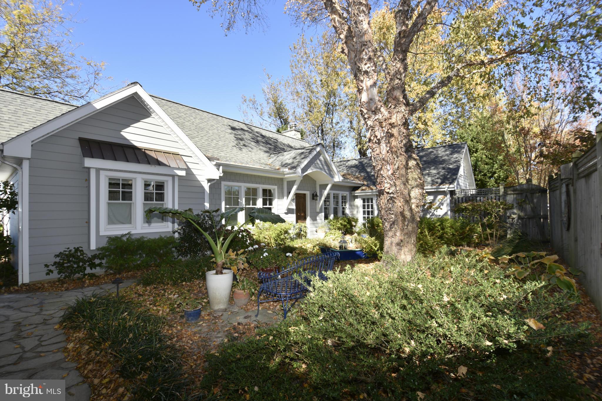 6050 Sunset Lane Tilghman, MD 21671 - Photo 2 of 74 a front view of a house with a yard and fountain