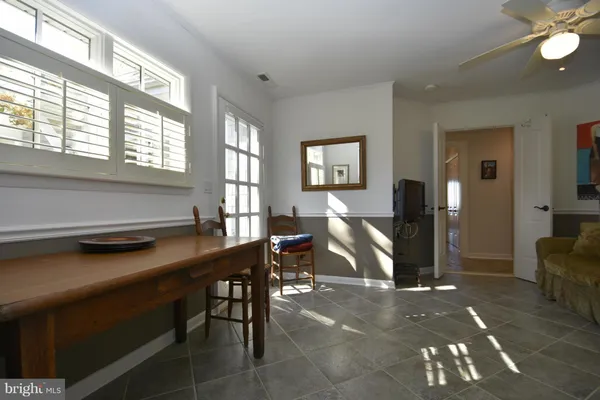 a bathroom with a mirror and a window