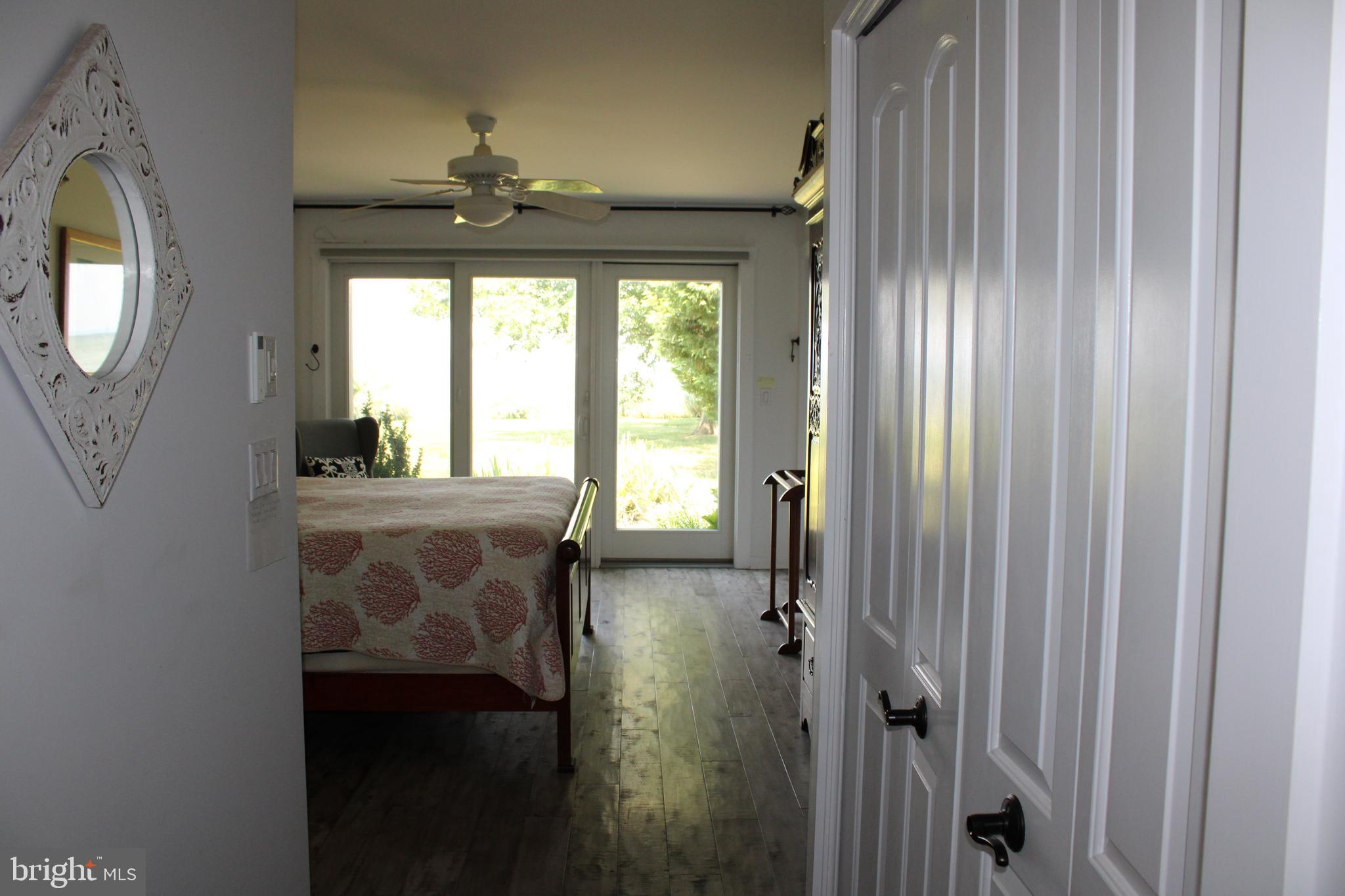 6050 Sunset Lane Tilghman, MD 21671 - Photo 37 of 74 a bathroom with a mirror and a window