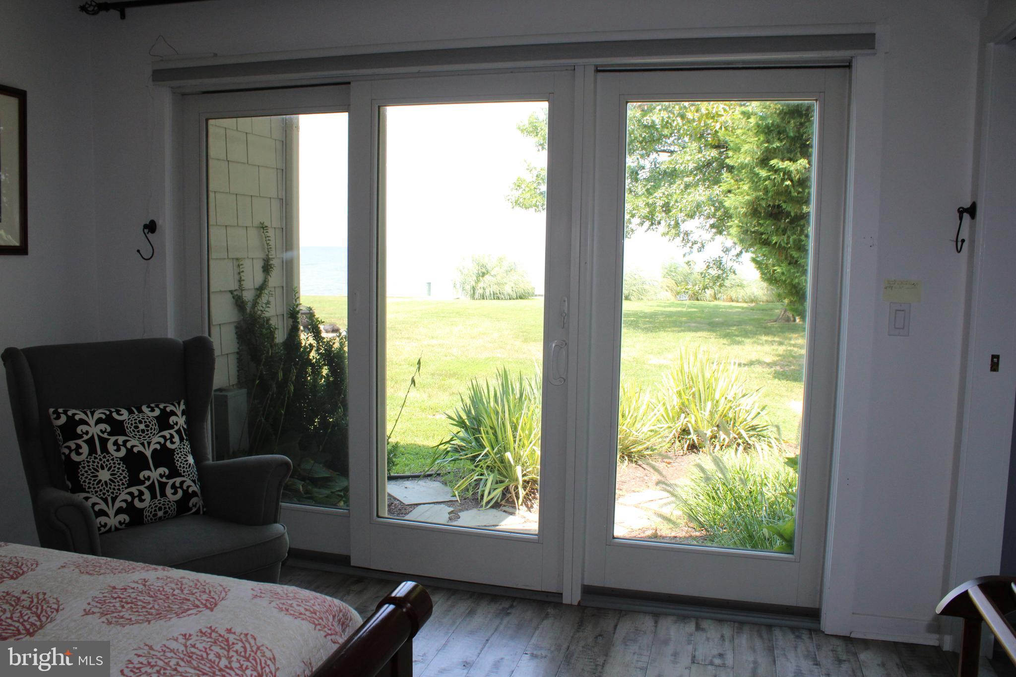 6050 Sunset Lane Tilghman, MD 21671 - Photo 39 of 74 a bedroom with a bed and a window