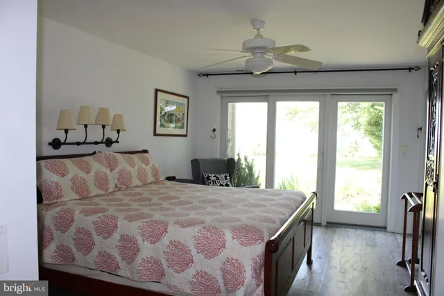 a view of a table and chairs in patio with wooden fence