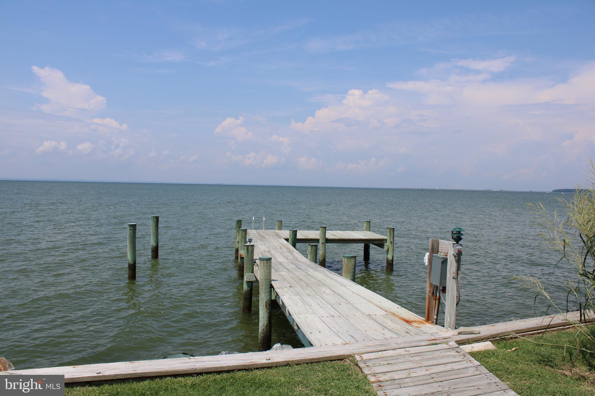 6050 Sunset Lane Tilghman, MD 21671 - Photo 60 of 74 a view of roof deck with two chair and a barbeque