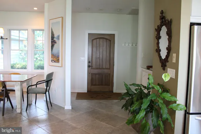 a kitchen with a dining table and chairs